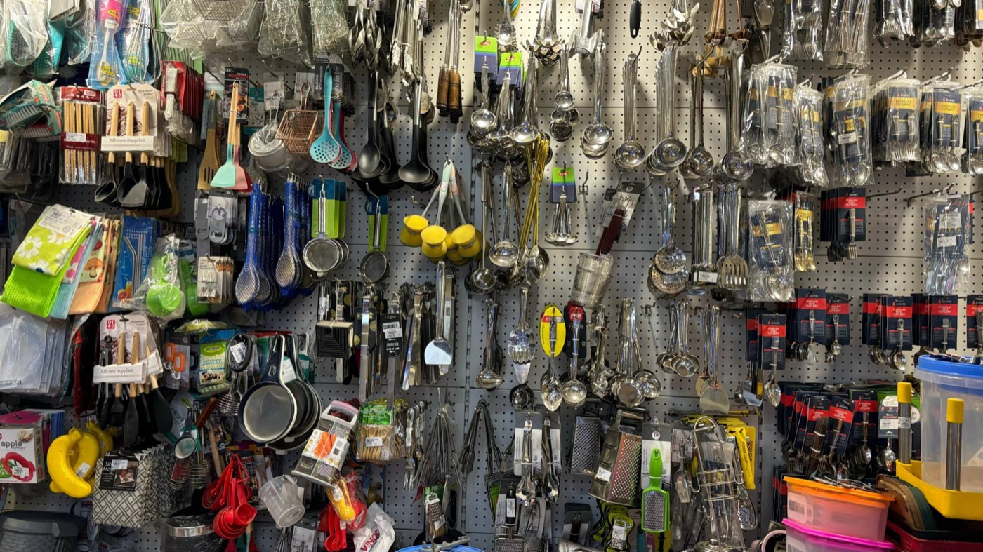 Kitchen tools and cutlery on a wall display